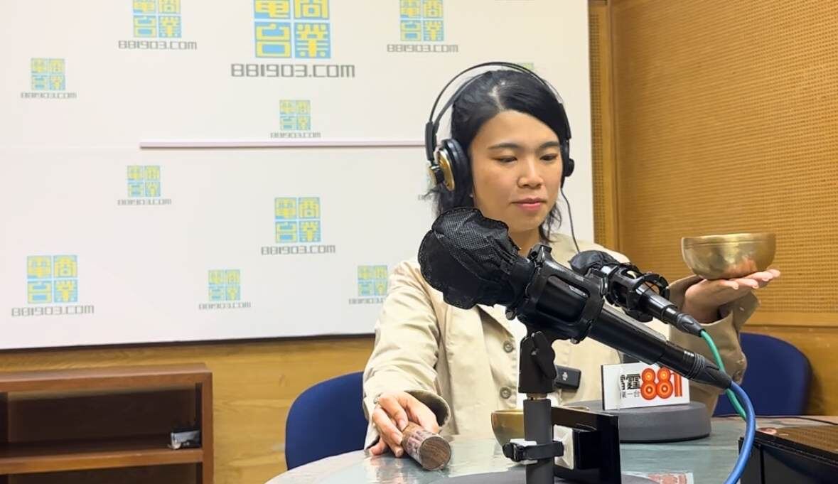 Helen with a singing bowl in the 881903 radio studio